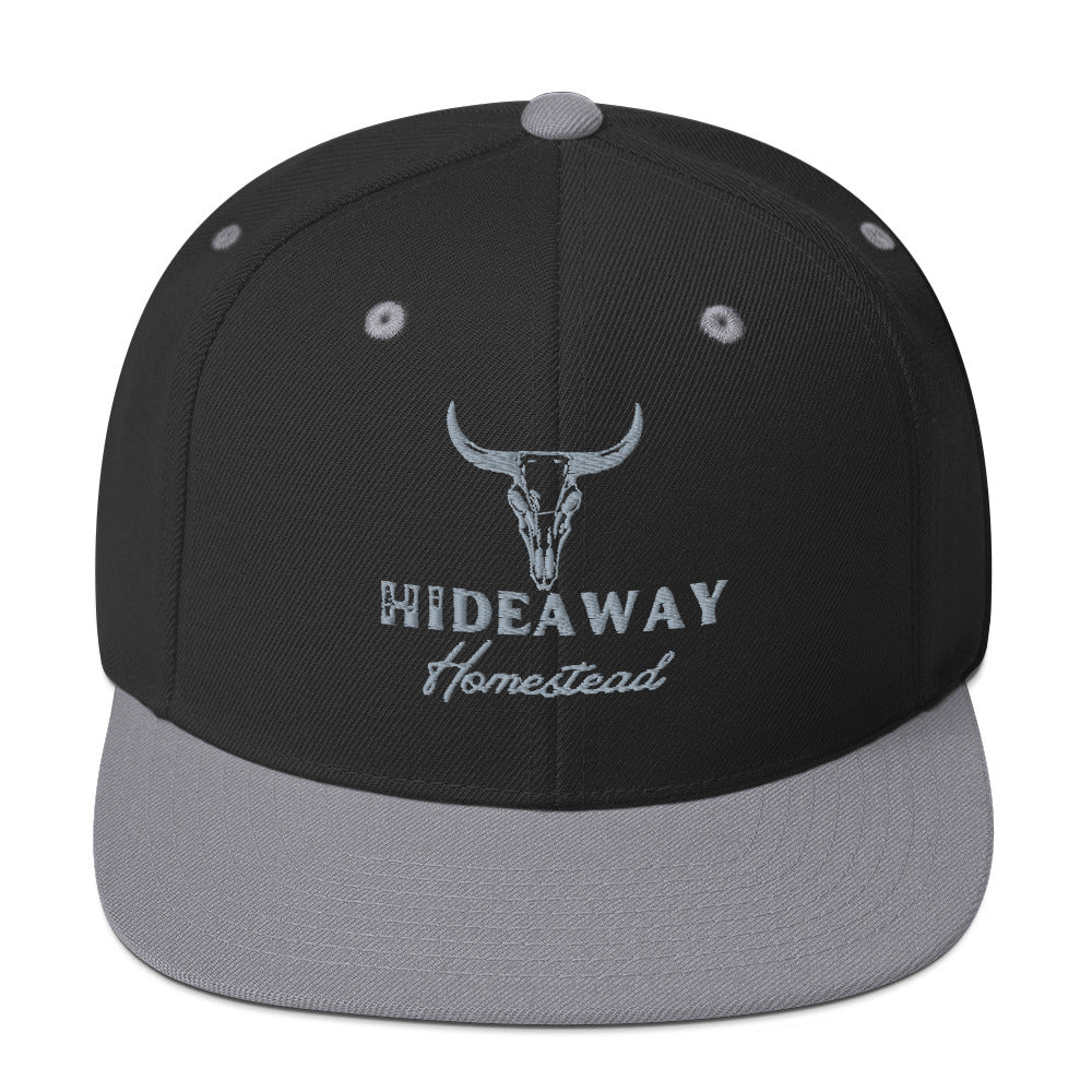 Product mockup Embroidered Hideaway Homestead logo on snapback hat”
“Off-grid ranch gear – Hideaway Homestead hat”
“Hideaway Homestead Ranch snapback in black