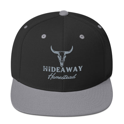 Product mockup Embroidered Hideaway Homestead logo on snapback hat”
“Off-grid ranch gear – Hideaway Homestead hat”
“Hideaway Homestead Ranch snapback in black