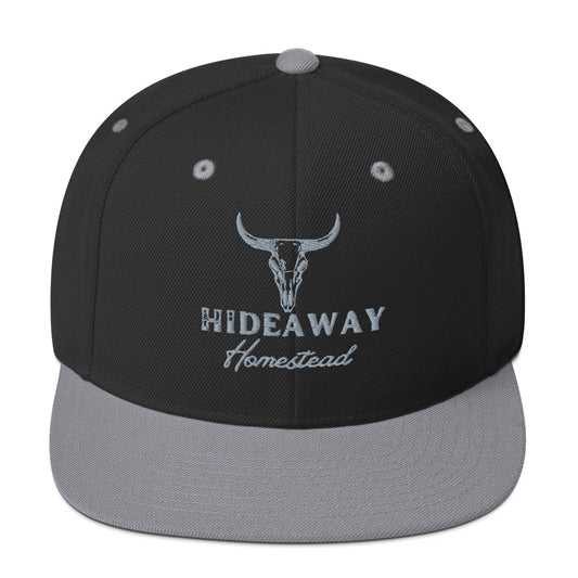 Product mockup Embroidered Hideaway Homestead logo on snapback hat”
“Off-grid ranch gear – Hideaway Homestead hat”
“Hideaway Homestead Ranch snapback in black
